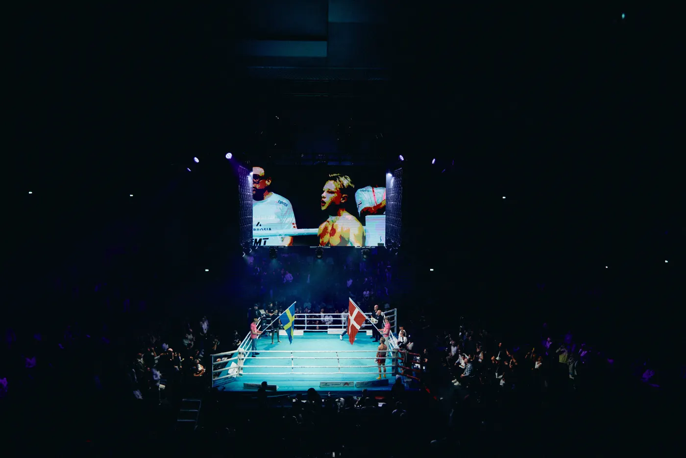The lit ring and the screens above it, seen from the stands at K.B. Hallen